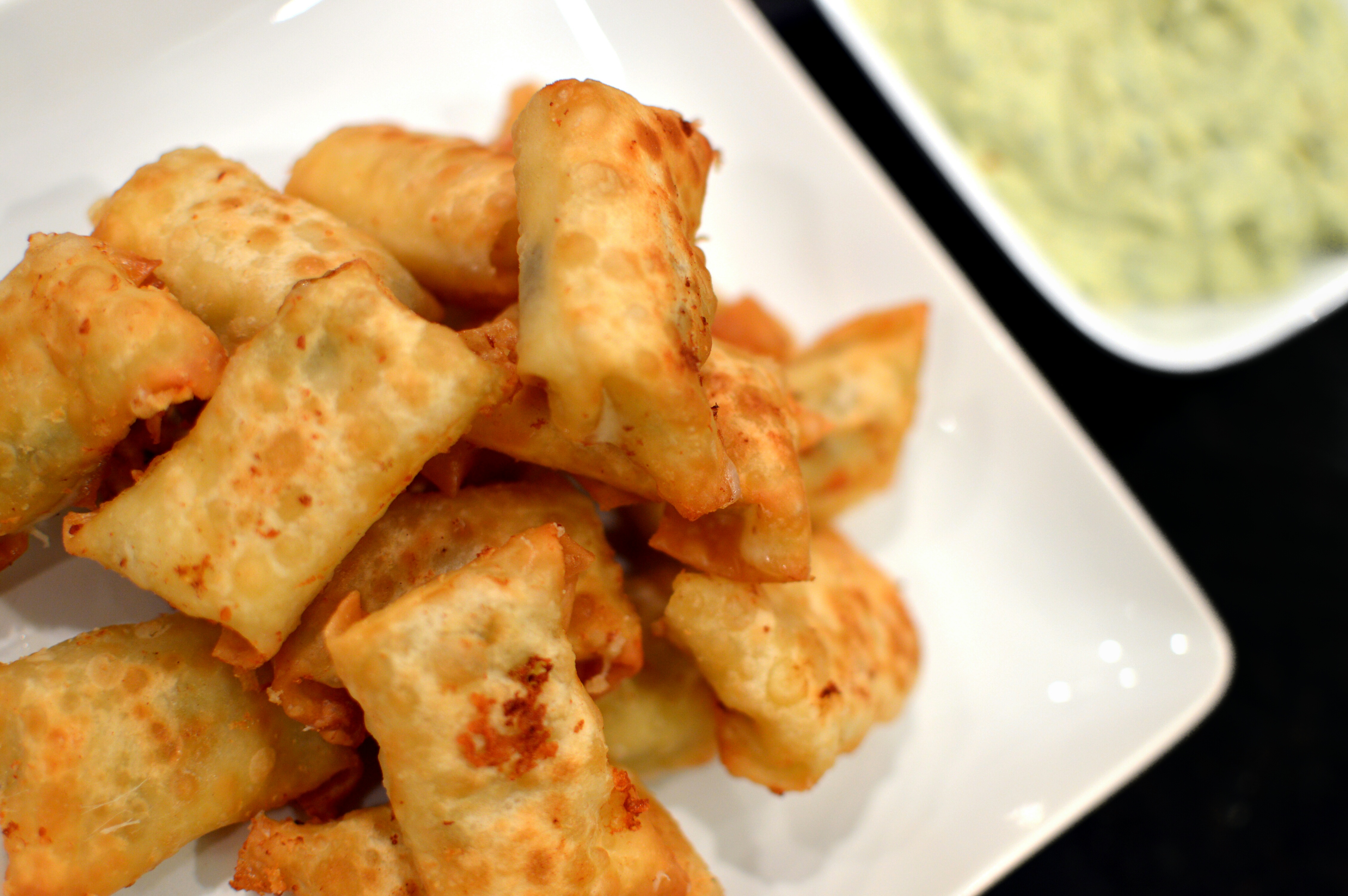 This recipe is one of our favorites of all-time. These originated from a restaurant in Louisville called the Bristol Bar & Grill. The mix of Monterrey jack cheese, green chilis, & jalapenos are mixed and fried in a wonton wrapper. The avocado based dip is a perfect complement to the wontons.