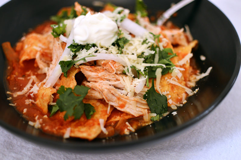 “Literally one of my favorite reciped I've blogged: Chipotle Chicken Chilaquiles. Crispy corn chips simmered with a chipotle salsa. Then topped with shredded chicken, sour cream, red onions, and cilantro. Recipe from ThatSquarePlate.com