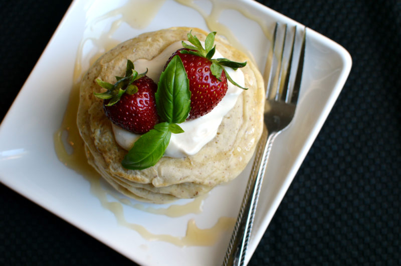 A simple, vegan pancake recipe made with almond milk and no egg. Serve with fresh berries and honey for a yummy, sweet, healthy start to your day!