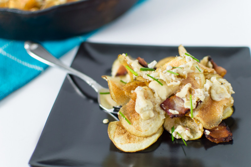 Love these chips when they're fresh from the fryer and topped with the warm gorgonzola cheese sauce, crispy bacon, and fresh chives.