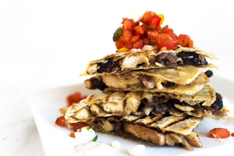 I put a twist on the Mexican style chicken quesadilla and added some Mediterranean flavors! Sliced chicken on a corn tortilla with feta, onions, and figs. Serve with harissa, bell pepper and tomato salsa, and drizzle with an herby sour cream sauce.