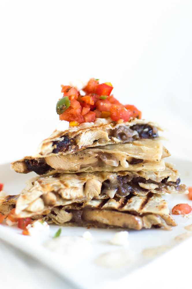 I put a twist on the Mexican style chicken quesadilla and added some Mediterranean flavors! Sliced chicken on a corn tortilla with feta, onions, and figs. Serve with harissa, bell pepper and tomato salsa, and drizzle with an herby sour cream sauce.