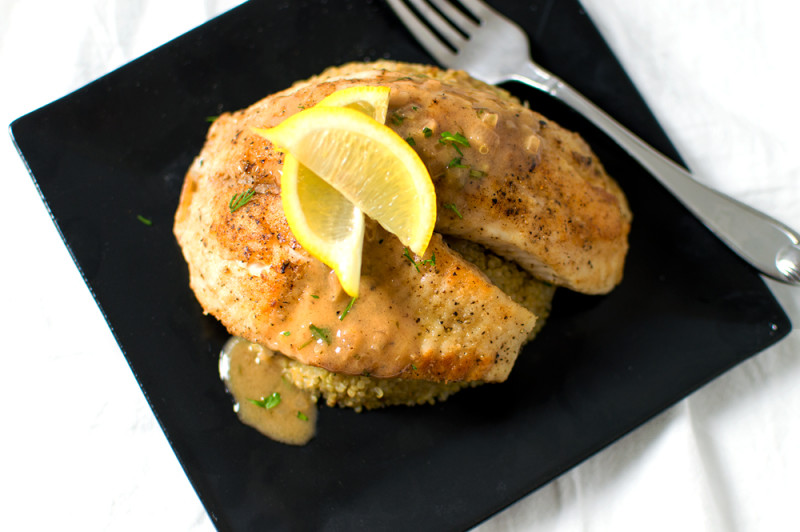 This tilapia is pan-seared and finished in the oven, then topped with a lemony-white wine sauce. I served over serrano-garlic quinoa.